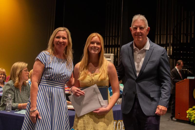 Autumn Larsen received the Darby Mowll RN Nursing Scholarship and F.H. & L.O. Russell Scholarship. Shown with Larsen are Principal Kristin DeGregory and Chuck Mowll.