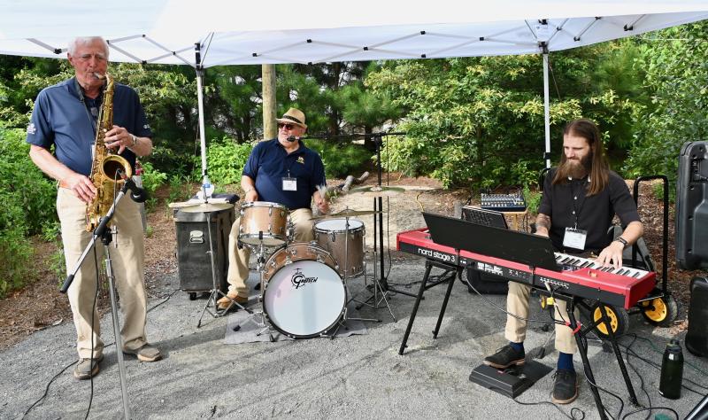 Fifth Avenue band members fill the gardens with music. They are (l-r) Monte Wisbrock, Ken Schleifer and Cody Munzert.