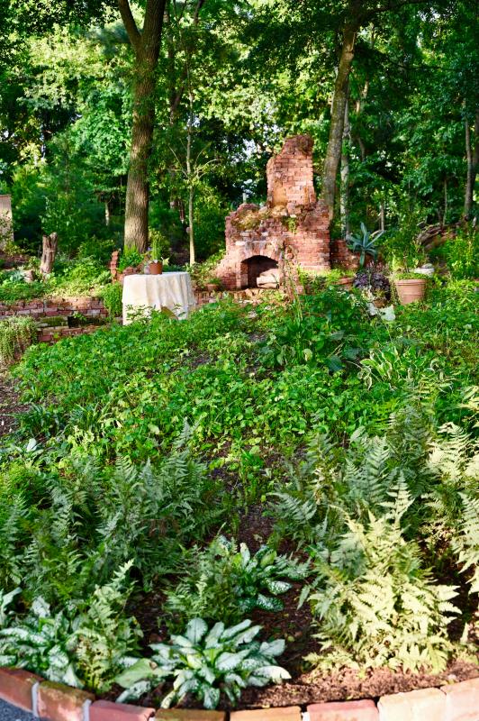 Folly Garden is always the coolest spot in the gardens with a grove of walnut trees. The garden was built at the site of the original 20th century farmhouse on the parcel. The garden features a reflecting pond, and 37,500 bulbs and shade-growing plants.