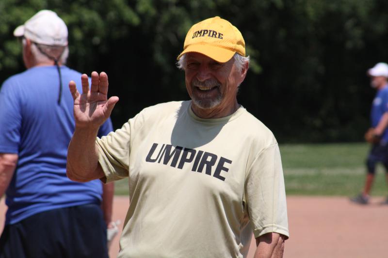 Umpire Jack Bobeck couldn’t help but find his way into the frame. Guys like Bobeck are an important part of the Olde Tymers Softball League, and the two-man crews maintain the league’s integrity.