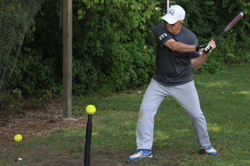 Millsboro Lanes player Kevin McCabe knocks a few off the tee to make sure his launch angle is correct. During spring training, the tees and other hitting tools get plenty of work.