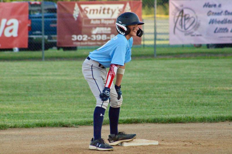 Lewes catcher Lucca Fazio stands on second with a smile after driving in a run on a double in the top of the first inning July 11.