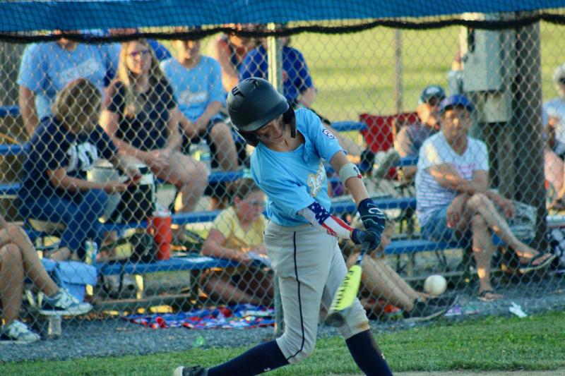 Lewes catcher Lucca Fazio launches a ball into the outfield in the top of the third inning of the first game.