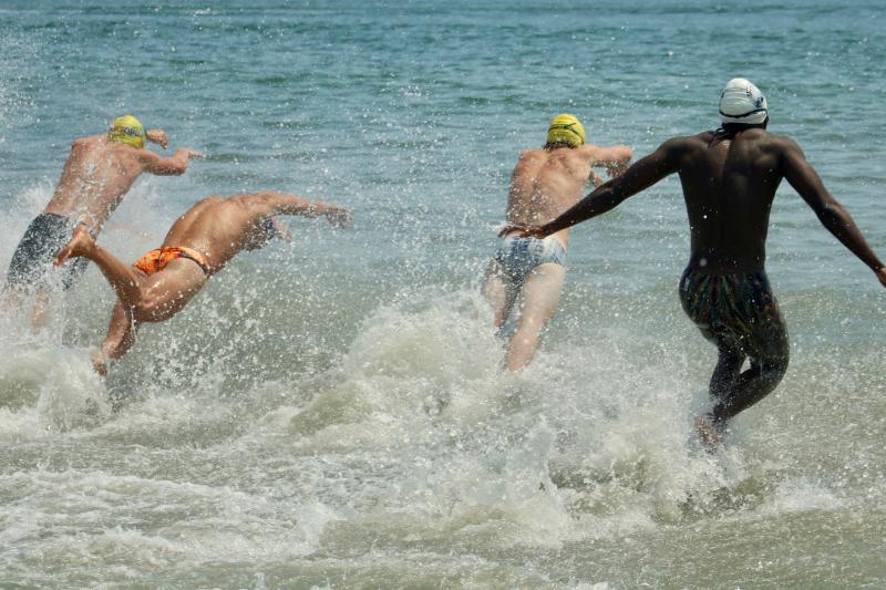 As they do when duty calls, these lifeguards show no hesitation when plunging into the Atlantic Ocean waves.