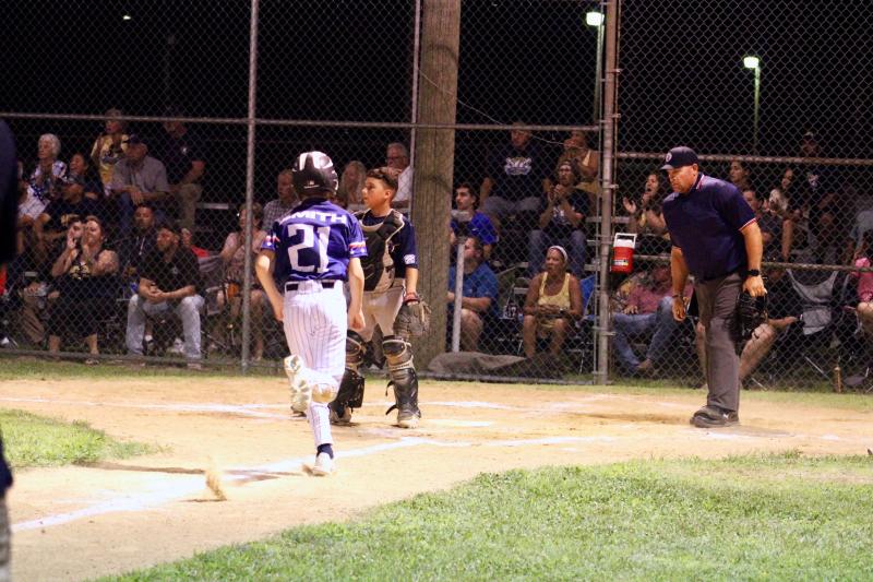 Milton Major All-Stars player Noah Smith scores the second of his three runs in the second inning against Nanticoke July 13.