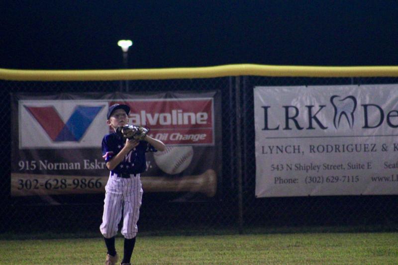 Milton Major All-Stars center fielder Andrew Ockles secures a catch in the top of the fifth inning against Nanticoke July 13.
