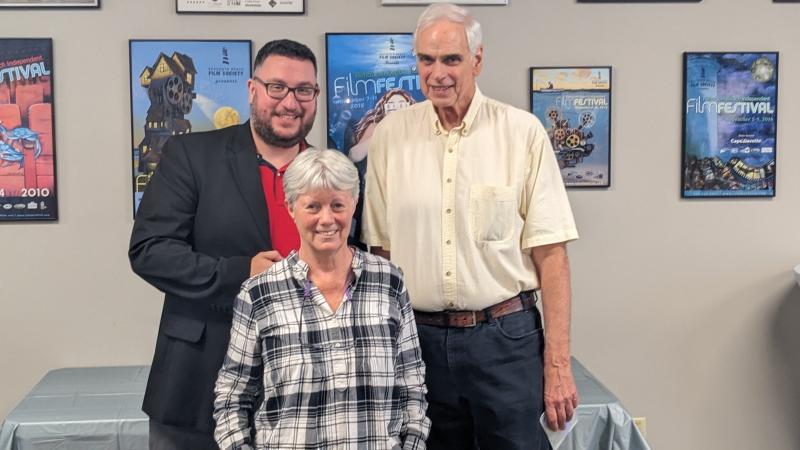 Lewes Historical Society Director of Education J. Marcos Salaverria, left, worked with 302 Stories Inc. for the documentary. Jeanne Covert, front, and Michael Oates of 302 Stories received several compliments regarding the quality of their production.