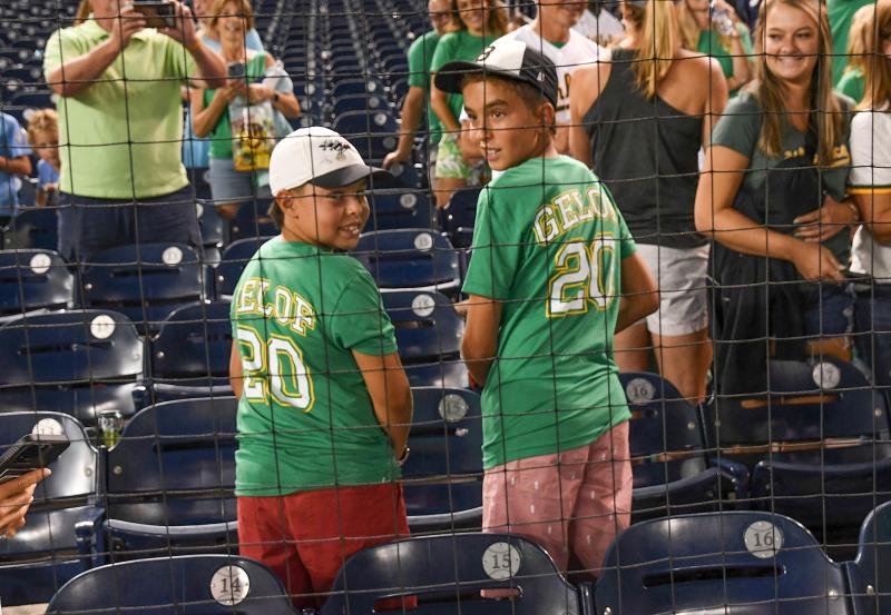 Bagel Bombers players Andrei Tobias, left, and Lucca Tobias show support for their hometown player. Zack Gelof came up through the Bagel Bombers organization.
