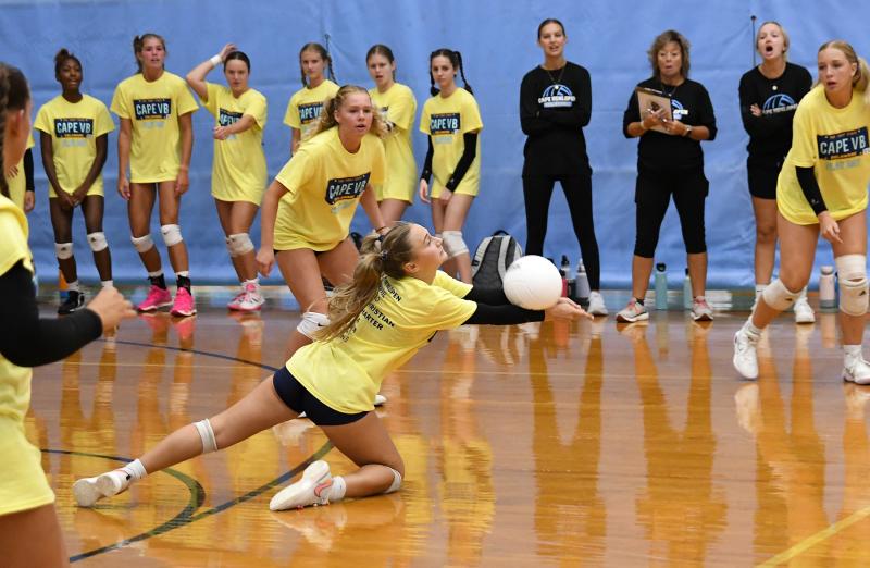 Cape defensive specialist Mallory Terhune makes a diving service return against Newark Charter. DAN COOK PHOTOS