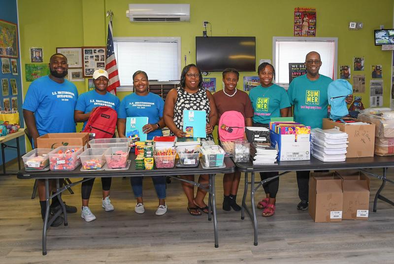 Getting together before the giveaway begins are (l-r) Shayne Brittingham, CEO and founder S.E. Brittingham Enterprises; I'Myia Custis, coordinator at S.E. Brittingham Enterprises; Tamela Brittingham-Harmon, executive manager at S.E. Brittingham Enterprises; Dilinda Deshields, program director at West Rehoboth Children & Youth Program; Kendall Victoria Deshields, volunteer; Latoya Bonville, volunteer; and Diaz Bonville, co-founder of West Rehoboth Children & Youth Program and president of West Side New Beginnings Inc.
