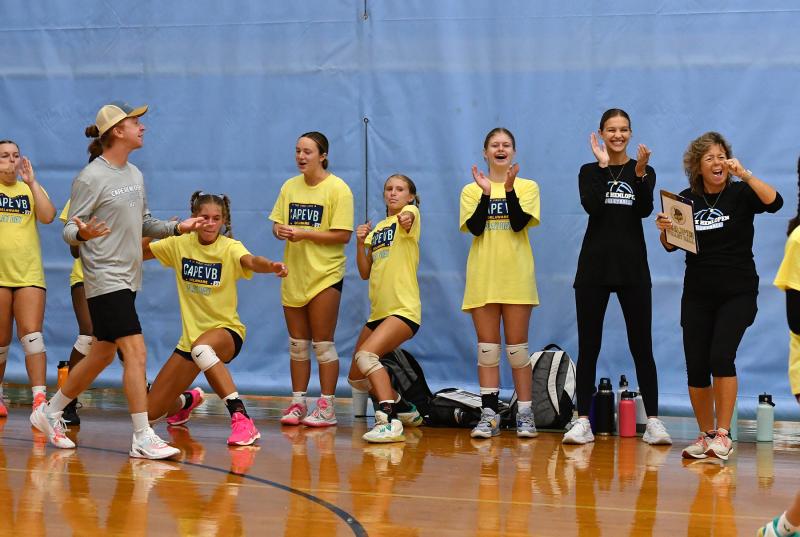 The Cape bench gets excited for a winning point against Newark Charter.