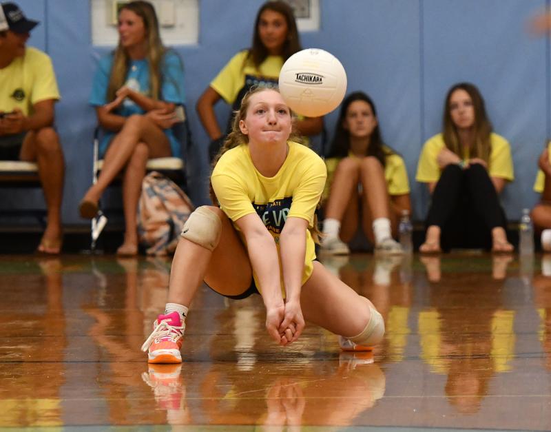 Cape junior Ava Calciano makes service return against Newark Charter.