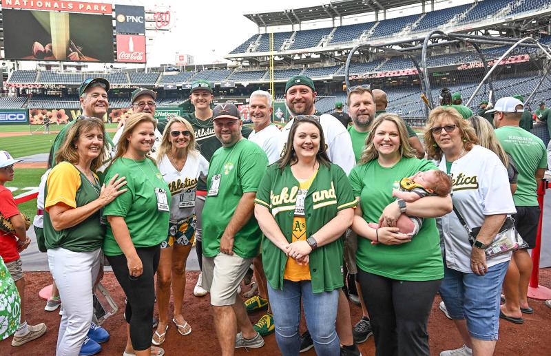 Attending the game to support Zack Gelof are his family. Shown in back are (l-r) Ed May, Bill Dunn, Zack, Adam (father), Kevin Dunn and Jeremy Bailey. In front are Donna May, Karyn Richard, Kelly (mom), Neal Richard, Devin Dunn, Meagan Bailey holding Cullen Bailey and Maureen Dunn.
