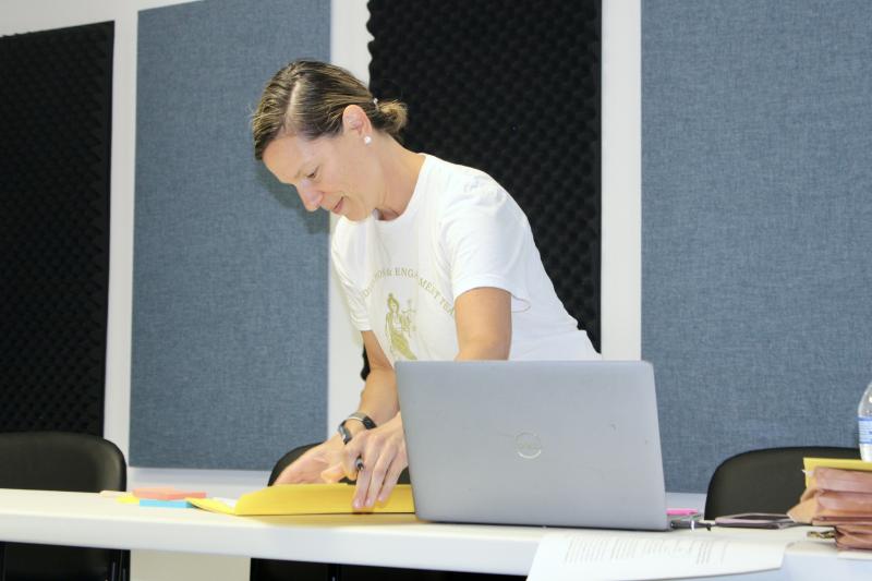 Eliza Hirst, an assistant public defender with the Delaware Office of Defense Services, reviews a case Aug. 10 during the Clean Slate Initiative event at Trinity Faith Christian Center in Lewes.