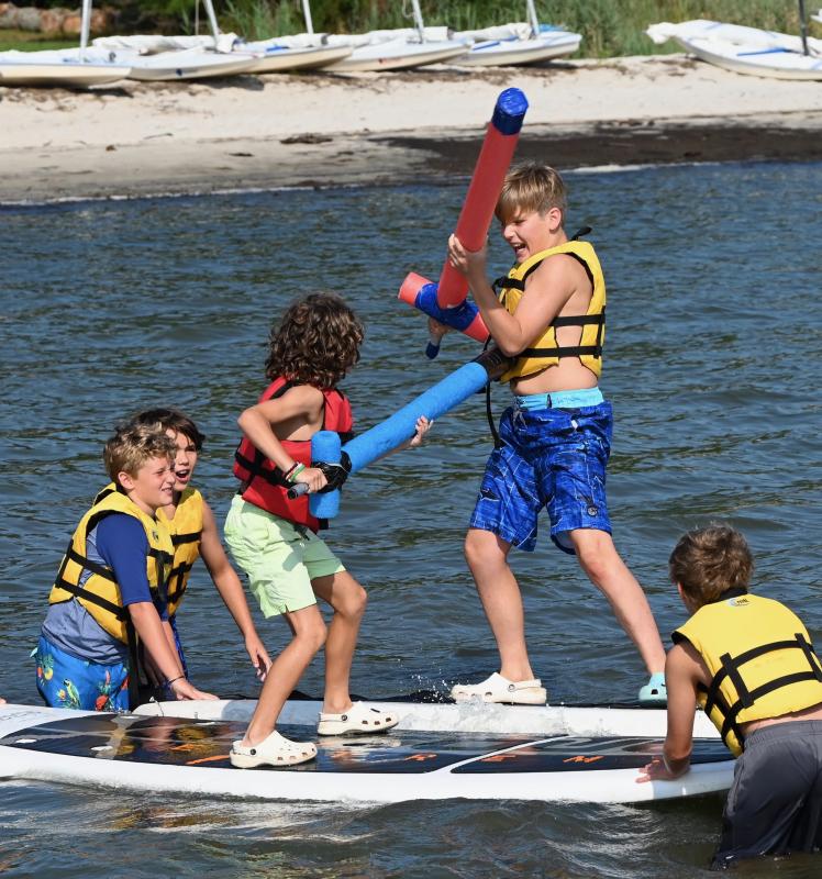 Jousting on the paddleboards are Gavin Robertson, Reese Webb, Chris Lentz, Ryan Whiteman and Griffin Govatos.