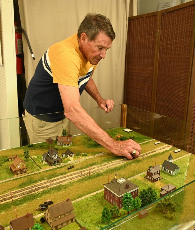 Paul Lovett works on his Rehoboth Beach diorama, which depicts Rehoboth Avenue in 1910, when the railroad was the focal point of the resort town. The diorama is on display at the Rehoboth Beach Main Street office. RON MACARTHUR PHOTOS