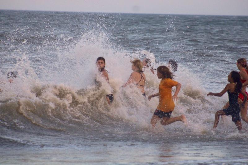 Some of the junior lifeguards were so pumped that they ran through walls for their team. Albeit walls of water.