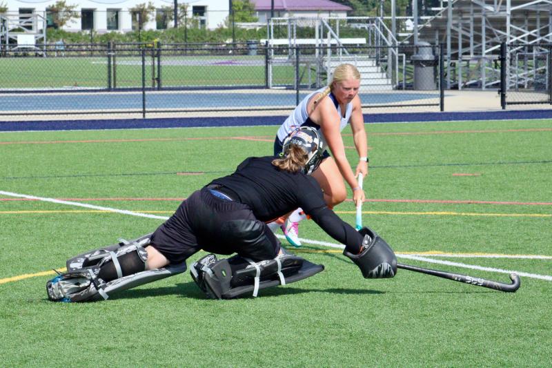 Sophomore goalie Abby Tatman extends to stop senior forward Callie Short’s drive to goal and subsequent pass attempt.