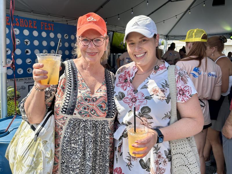 Checking out silent auction items while enjoying their crushes are Holly Sheesley, left, and her niece Kylie Sheesley of Lancaster, Pa. ELLEN DRISCOLL PHOTO