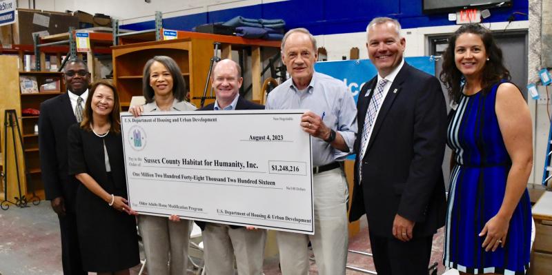 At the check presentation are (l-r) Scott Bosley, Habitat for Humanity of New Castle County; Maria Bynum, HUD Delaware field office director; U.S. Rep. Lisa Blunt Rochester; U.S. Sen. Chris Coons; U.S. Sen. Tom Carper; Kevin Gilmore, Sussex County Habitat for Humanity CEO; and Jocelyn Nice, Central Delaware Habitat for Humanity. RON MACARTHUR PHOTOS