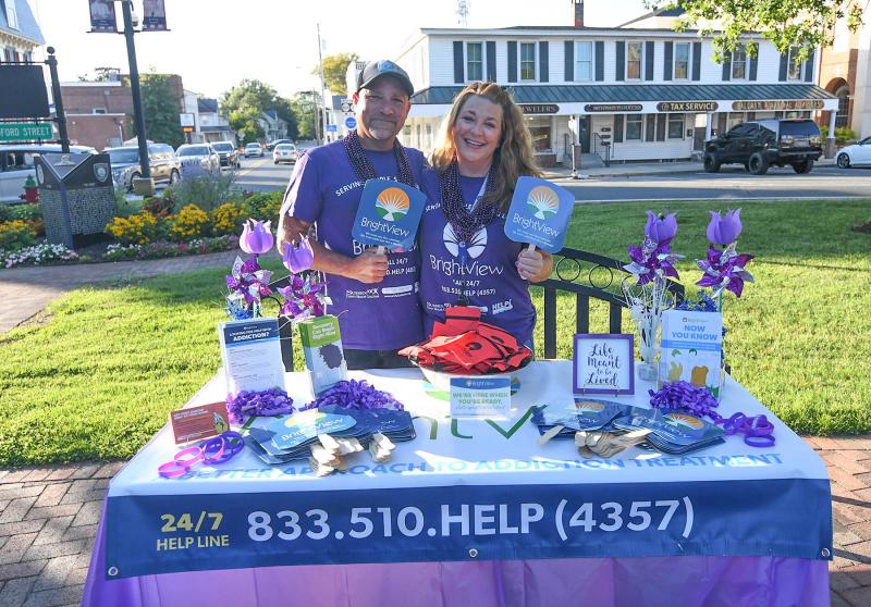 Melvin Durand, left, and Angie Ficco give out information at the BrightView recovery treatment center in Georgetown.