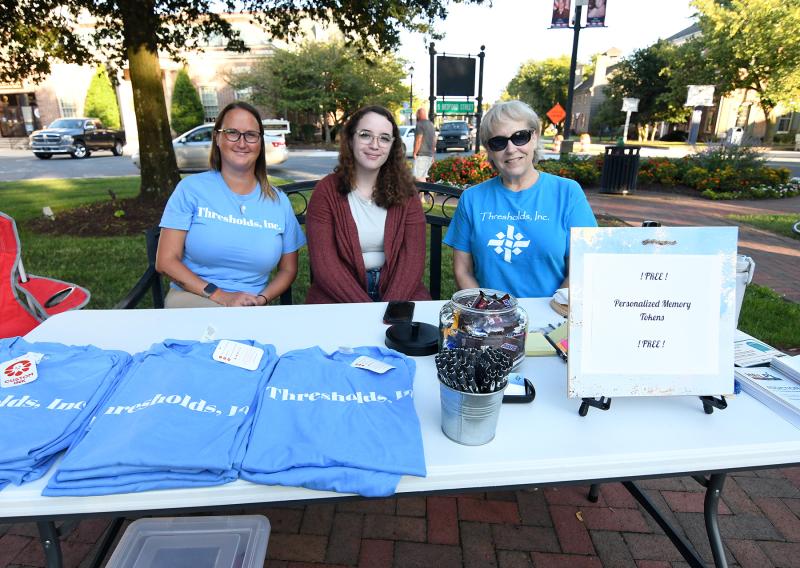 Handing out information from the Thresholds table are (l-r) Monica Bayless, Haylie Baker and Sue Harris.
