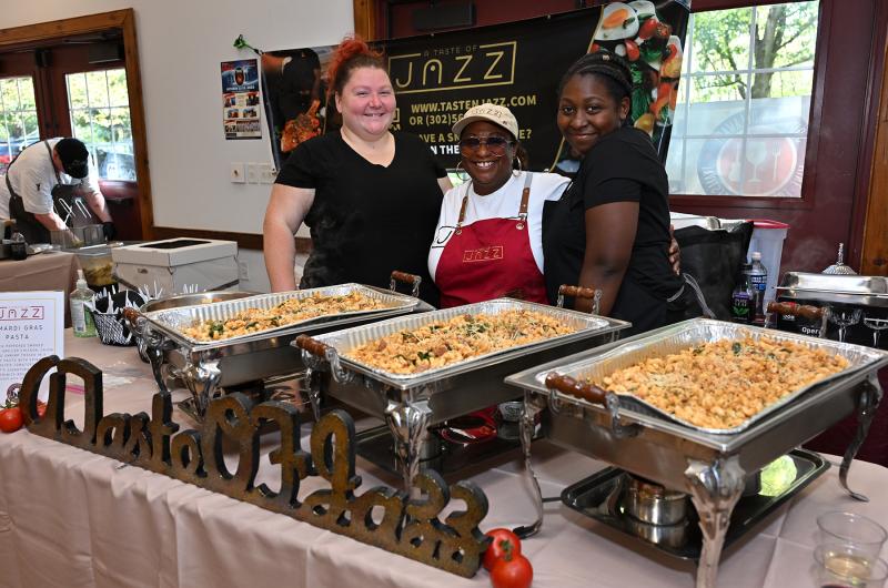 Serving Mardi Gras Pasta from A Taste of Jazz are (l-r) Krystal Galawish, chef Latisha “Jazzy T “Dismuke and Kamiya Galawish.