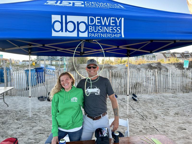 Accepting donations for Dewey Business Partnership are volunteers Lisa Myerberg, left, and Rob Gross of Roof Rite. ELLEN DRISCOLL PHOTO