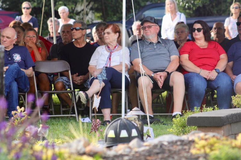 The Whitford family listens as people recall where they were and what they were doing Sept. 11, 2001.