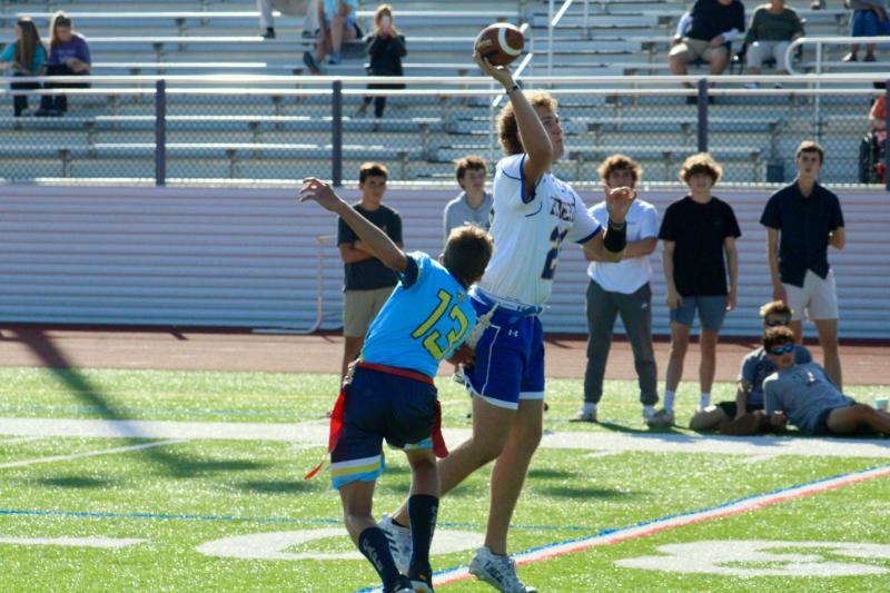 Vikings senior Connor Pencek nearly gets his first sack against Riders senior quarterback Patrick Easton, but still forces an early throw.