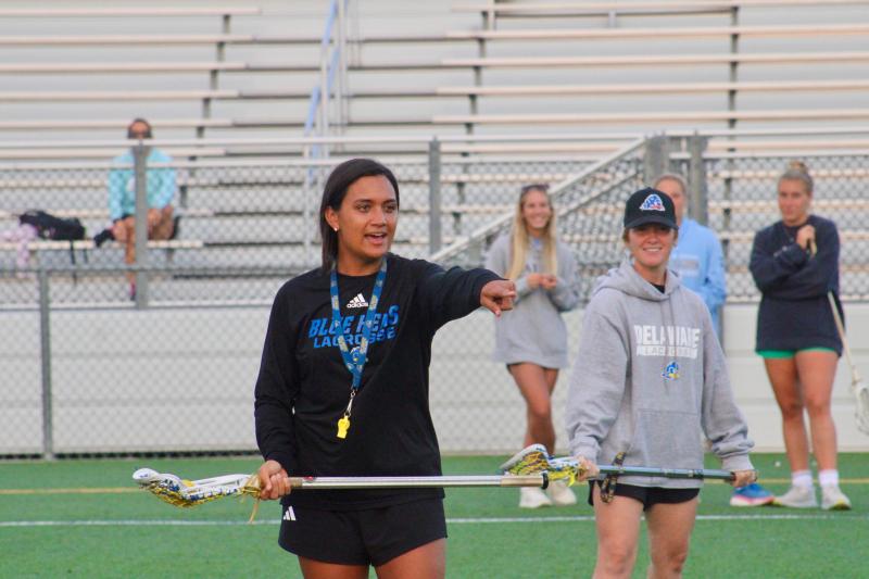 University of Delaware associate head coach Steph Lazo, left, coaches up the girls during the first clinic as fellow associate head coach Kara Nakrasius looks on.