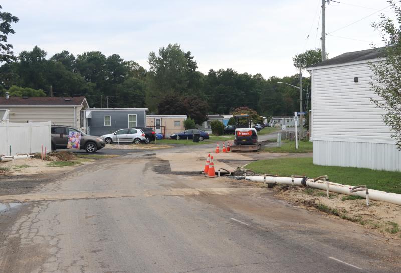 People who live in Donovan-Smith want owner Ken Burnham to fix overflowing septic tanks, electrical issues and deteriorating streets.