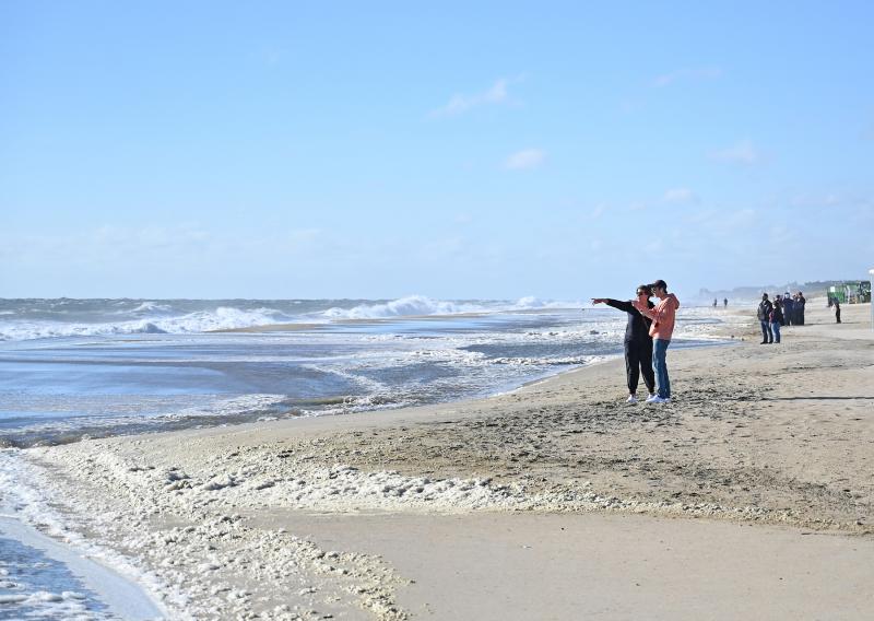 There’s a lot of activity on the beach in Rehoboth Sept. 15, as people check out the rough conditions.