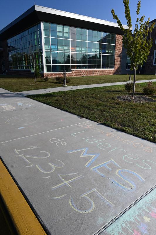 Messages left on the sidewalk outside Milton Elementary were in English and Spanish. NICK ROTH PHOTO
