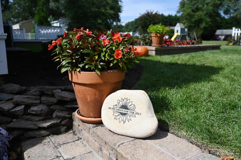 Garden tour participants are given a commemorative rock to display, as shown at the Collick home in Overbrook Shores.
