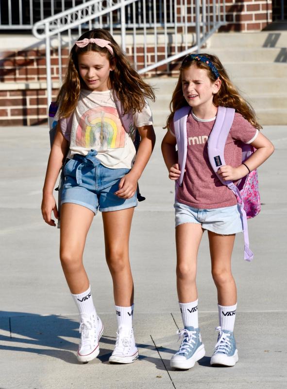 Sisters Josephine and Mauve Crowell head to the entrance of Lewes Elementary School on the first day. RON MACARTHUR PHOTO