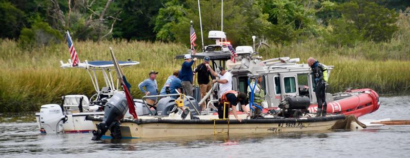The salvage operation in the Lewes-Rehoboth Canal includes Coast Guard, Tow Boat US and a dive team. Work to raise the sunken boat began early Sept. 25. RON MACARTHUR PHOTO