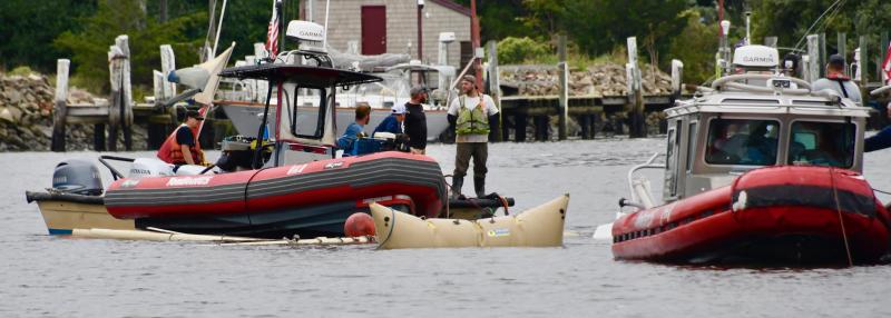 Most of the sailboat has submerged below the canal waters as a large air-filled bladder helps crews tow it. RON MACARTHUR PHOTO
