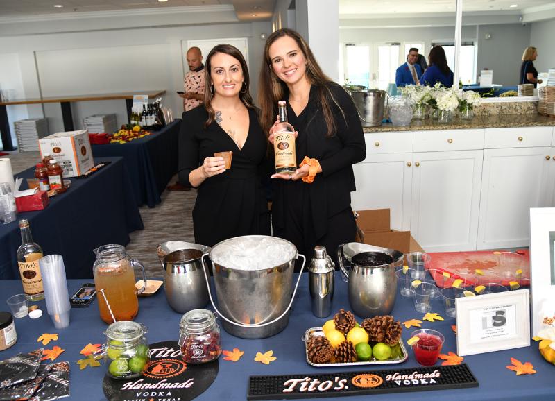 Gigi Mulrooney, left, and Emma Charlton of Tito’s Vodka serve up tasty libations.