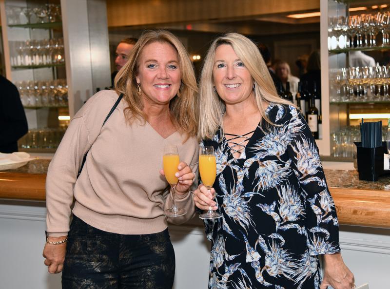 Kimberly Welch, left, and Jane Martinko enjoy a libation at the bar.