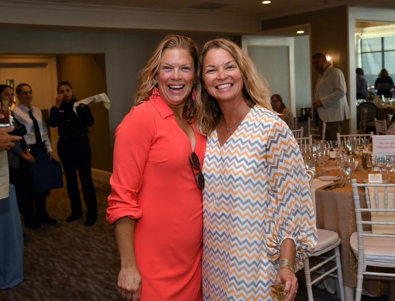 Having a great time at the mixer are Nicole Bailey Ashton, left, and Melissa Clampitt.