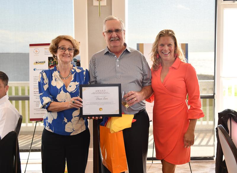 Meals on Wheels Executive Director Anne Love, left, and Nicole Bailey Ashton present an award to Meals on Wheels driver and Volunteer of the Year David Lewis. DAN COOK PHOTOS