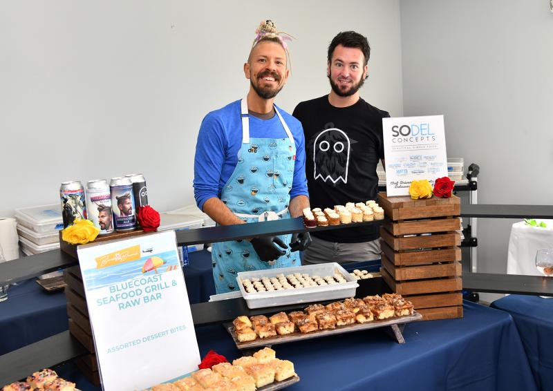 Offering tasty desserts from SoDel Concepts are Dru Tevis, left, and Chase Cline.