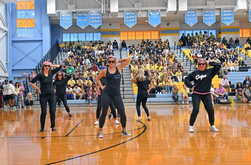 Staff members perform a dance at the pep rally. They are (l-r) Amy King, Christy Bogle, Alison Palmer, Dawn Clark, Julie Boyd and Cape Principal Kristen DeGregory.