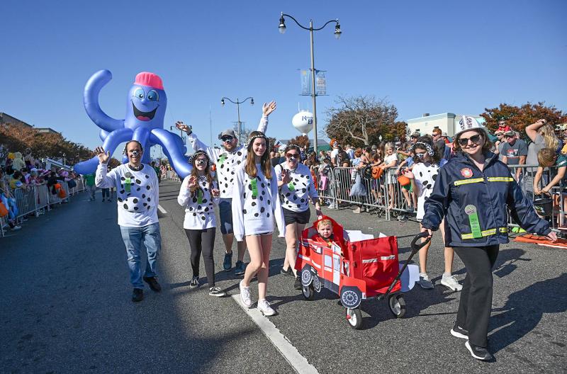 Junior firefighter Theo Lamparter rides with his Dalmatians (not in order) Kevin Lamparter, Julia Miller, Joanne Lamparter, Doug Miller, Isabel Miller and Karen Miller.