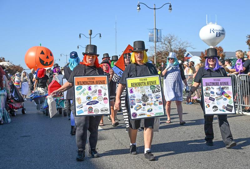 Game parts in the group Monopoly Rehoboth-Style Team Edge walk the parade route. Their group took first place for their costumes.