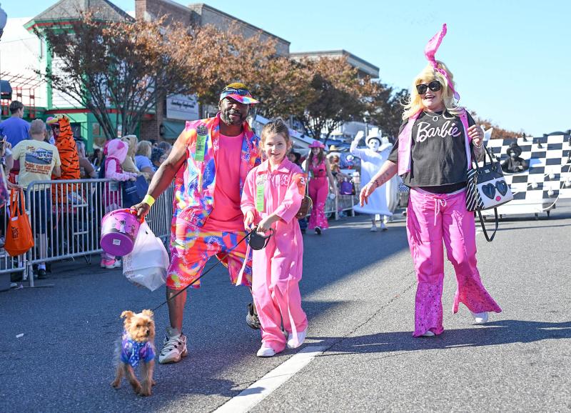 The Barbie Family includes Derek Nichols as Ken and Tonya Nichols as Barbie. Granddaughter Mia Morris, 8, is Stacie. Accompanying them is their dog, BooBoo.
