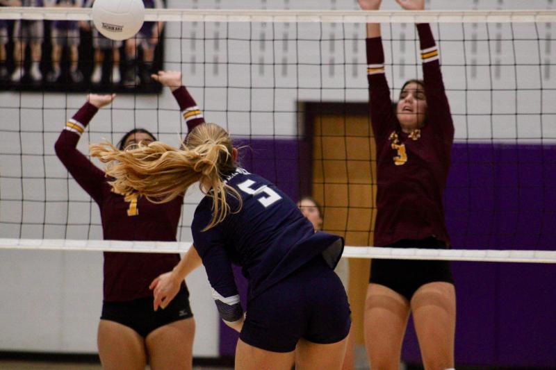 Sussex Academy senior Carmen Merrick collects one of her four kills in the match. The ball clipped the net, but made it over for the point.