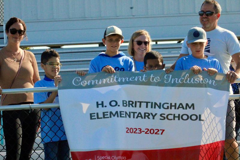 Named a state banner school for its commitment to inclusion, H.O. Brittingham was acknowledged for its efforts prior to the bocce ball tournament. Shown with the banner are (l-r) Julie Hickman, Daniel Fernanedez-Rodriguez, Dylan Yost, Amy Brown, Diego Revolorio, Brody Deas and Bill Funkhouser.