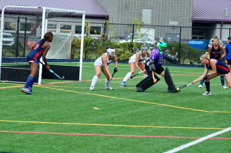 Seahawks sophomore Kacie Rawlings stomps out the Patriots attack. She made her 100th save of the season in the third quarter. Shown are (l-r) Samira Morgan, Madison Jones, Ava Yenovkian, Rawlings, Catherine Cowgill and Addison Nelson.